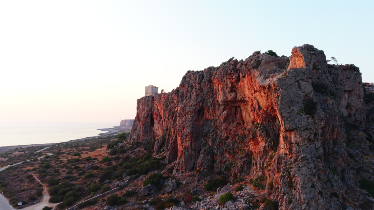 Sunset over rocky cliffs in Sicily, Italy captured with a drone outside