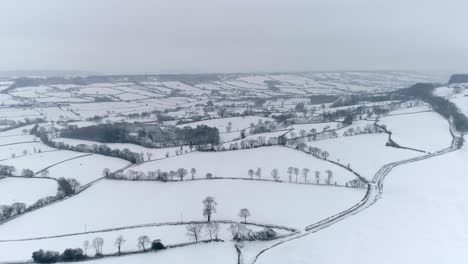 beautiful full snow cover vista shot of english rural countryside