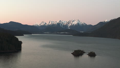 Morning-Majesty:-Nimpkish-Lake-and-Snow-Covered-Peaks-at-Sunrise