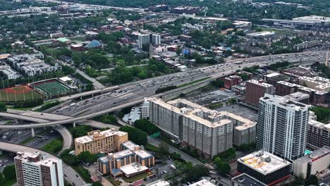 Panoramic-aerial-view-of-Downtown-Atlanta-expressway-traffic,-Georgia,-USA