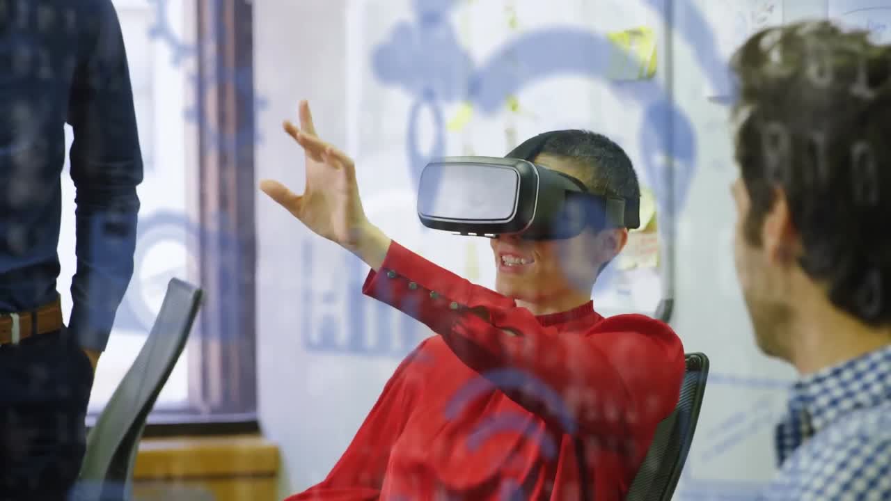 Digital icons and binary coding against caucasian businesswoman wearing vr headset at office