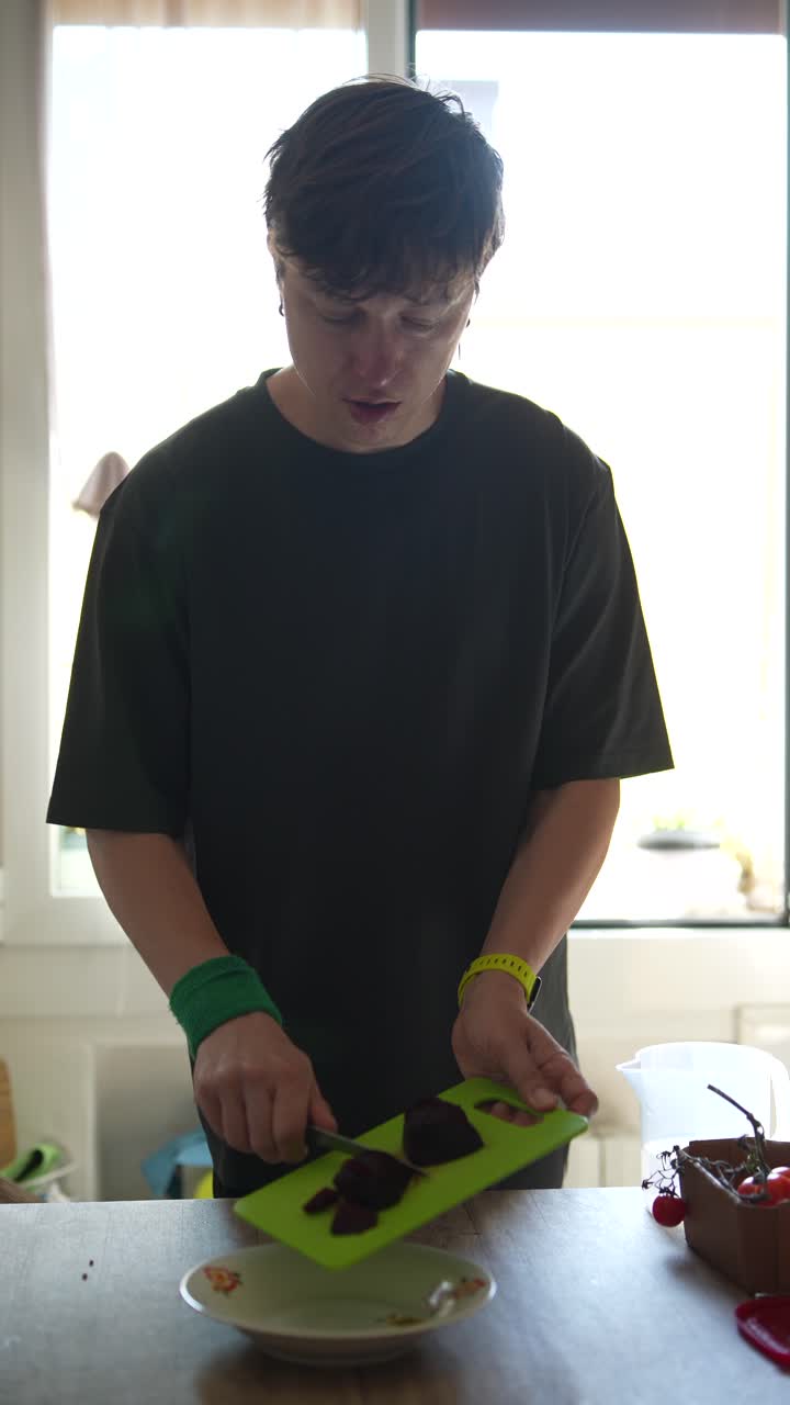 Person Chopping Beetroot in Kitchen