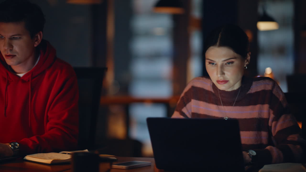 People working together in the office at night