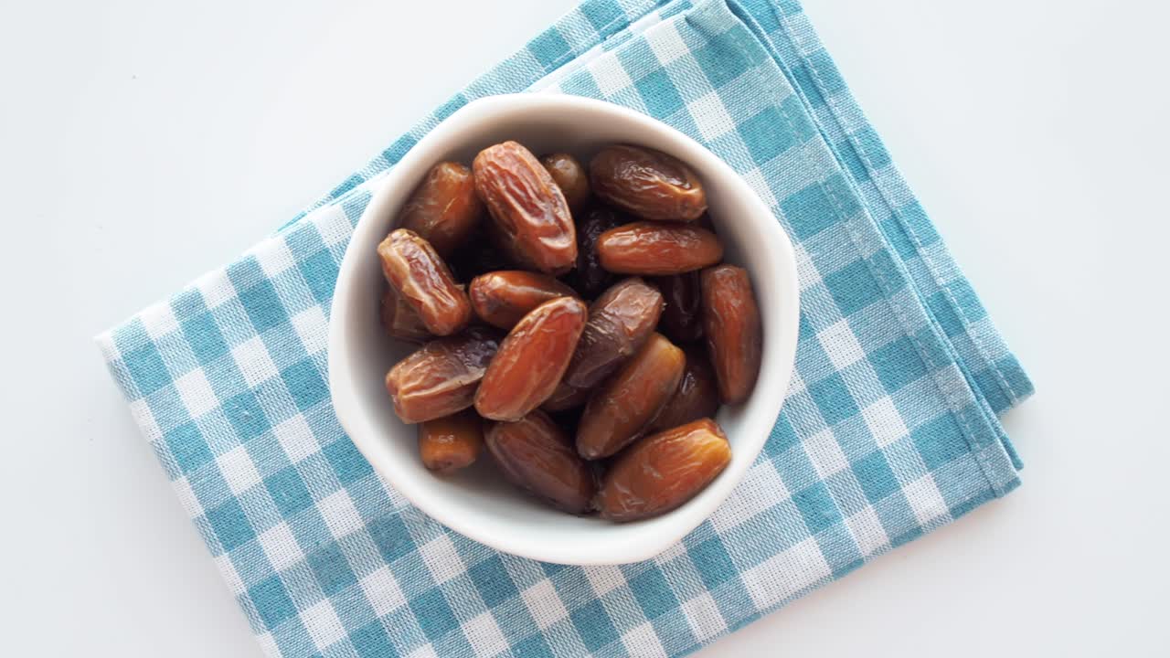 Dried Dates in a White Bowl