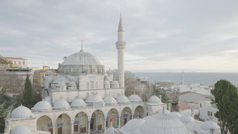 beautiful white mosque on background of cloudy sky. action. grand mosque with great history attracts tourists from all over world. istanbul mosques