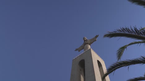 sanctuary-of-Christ-the-King-religious-monument-with-with-tilt-up-camera-movement-in-Lisbon,-Portugal