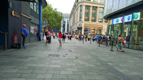 street performance captivates crowd in busy shopping area