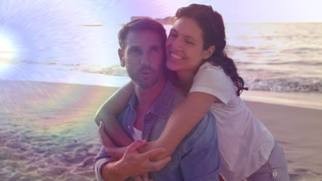 animación de luz moviéndose sobre una feliz pareja caucásica en la playa