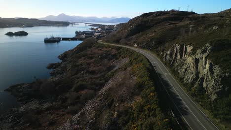 deserted road to kyle of lochalsh with skye bridge and cuillin mountains in scottish highlands