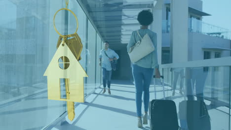 animation of gold house key and key fob over diverse businesspeople