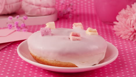 pink glazed donut with marshmallows