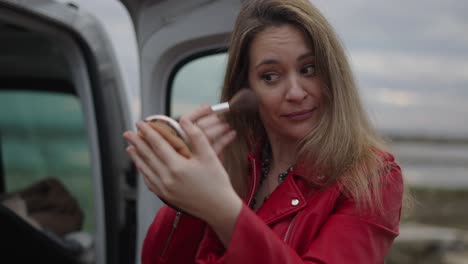 applying makeup outdoors