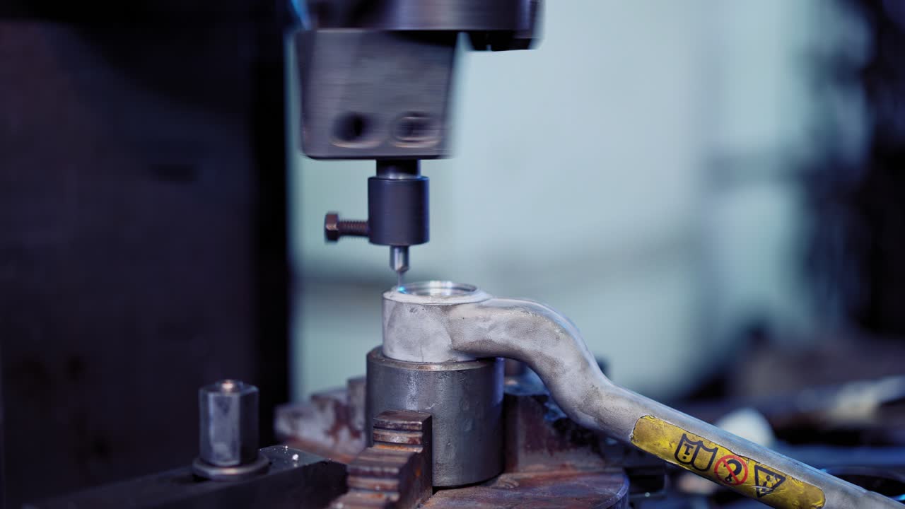 Worker in factory using machine. Professional worker on the factory working with machinery