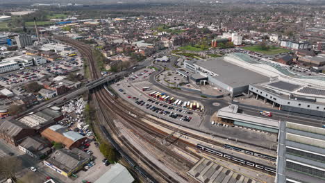 Daytime-birds-eye-fly-over-Hull-Paragon-Station-as-a-train-leaves