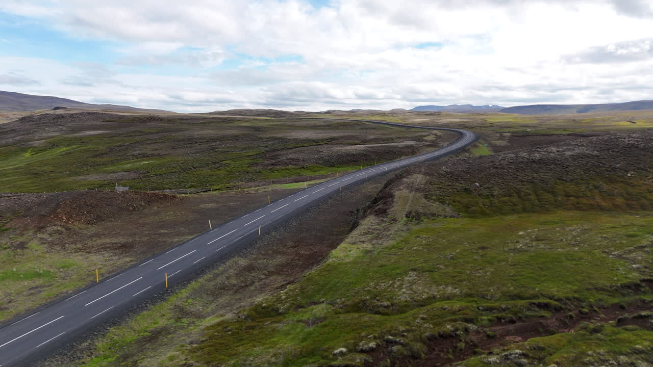 Aerial view of the highland landscape in Langanesbyggð, Iceland, showing rugged terrain, rolling hills, and wide open natural scenery