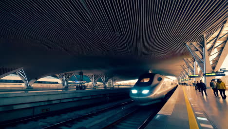 high-speed train arriving at a modern station