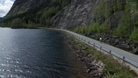 Road-cyclist-riding-in-beautiful-nature-in-Norway