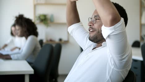 side view of tired young man finishing work