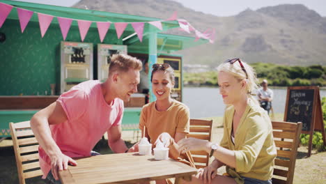 friends enjoying ice cream outdoors