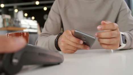 man making payment through smartwatch 4k