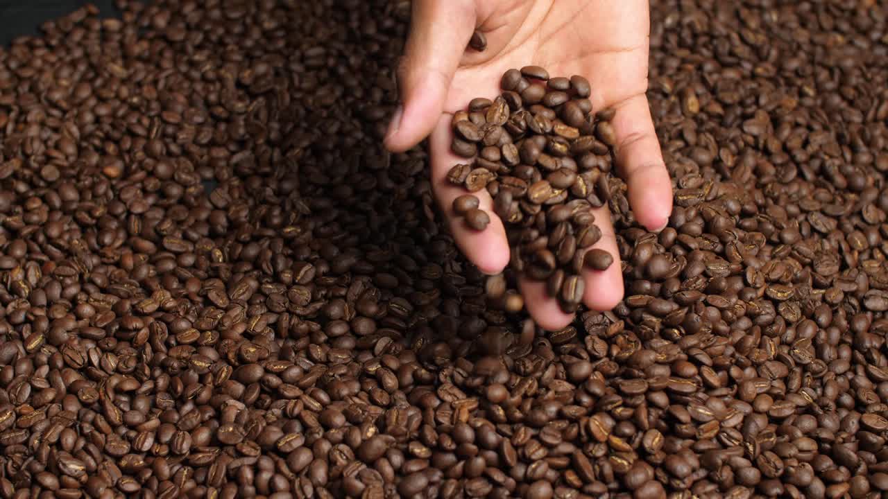 Human Hand Touching Roasted Coffee Beans, Video In 4K, 50Fps
