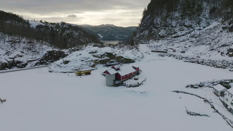 red and white houses in snow covered valley