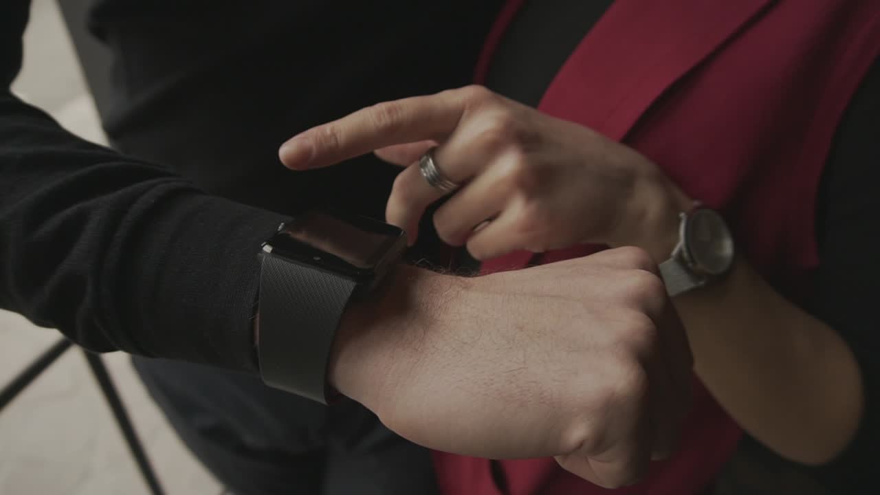Couple using smartwatch