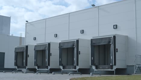 a large distribution warehouse with gates for loading goods