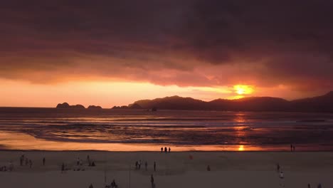 Aerial-slow-shot-of-a-beautiful-red-sunset-in-the-Red-Island-of-Java