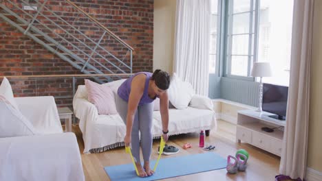 caucasian vlogger female exercising at home