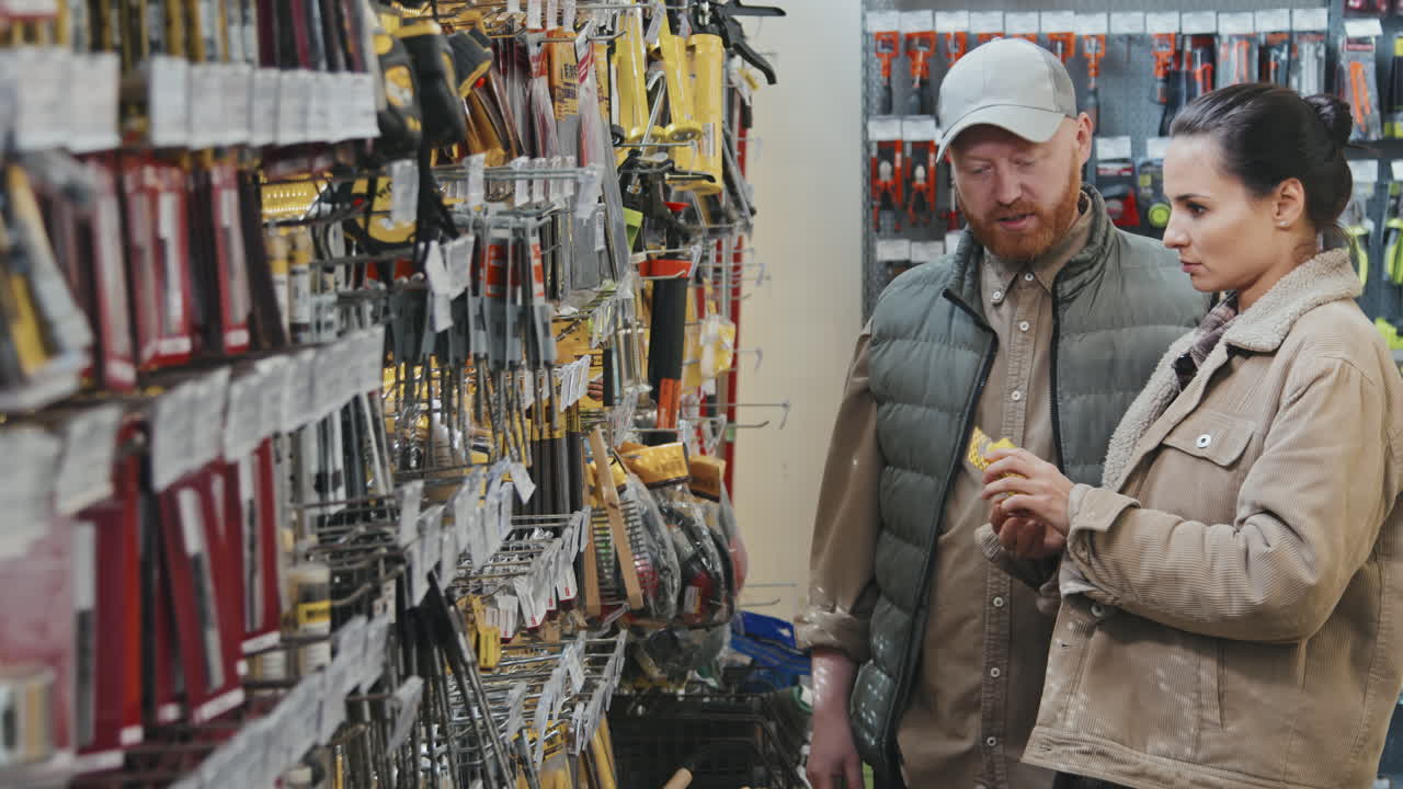 Man and Woman Talking and Shopping at Hardware Store