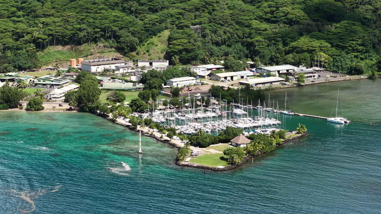 Moorea Island, French Polynesia. Aerial View of Boat Harbor, Sailboats, Coastal Traffic and Buildings