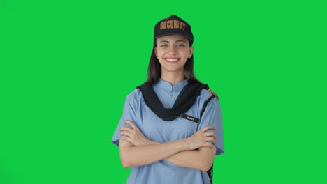 Portrait-of-Happy-Indian-female-security-guard-Green-screen