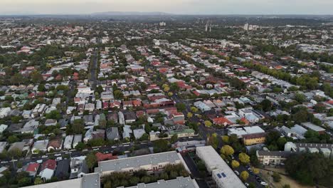 aerial view of a sprawling residential area with numerous houses and tree-lined streets