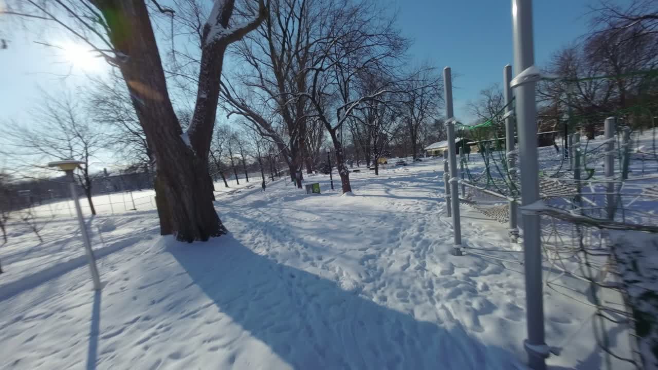 Playground winter at Parc Lafontaine, Montreal, Canada. Fpv shot.