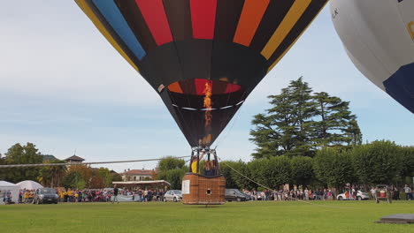 launching hot air balloon in angera italy, low altitude still shot