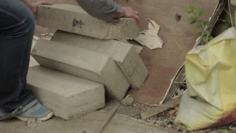 clearing rubble bricks from a dumping area