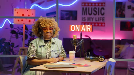 woman radio host in a podcast studio