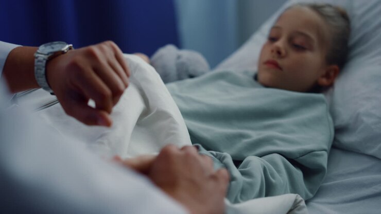 Upset girl lying hospital bed undergoing medical examination in ward portrait.