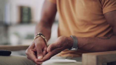 a man checking his blood sugar levels at home