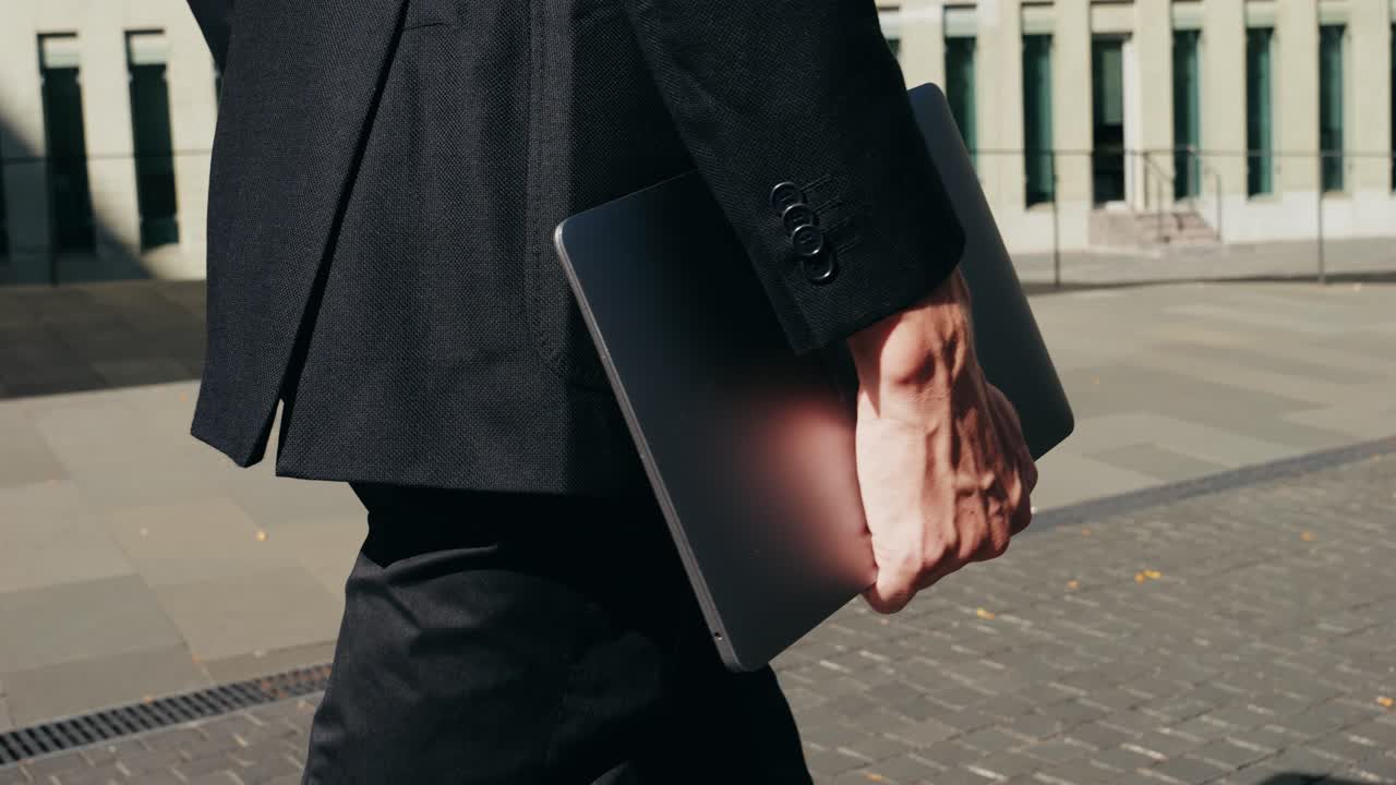 Man businessman boss walking near his office center in a dark business suit, Experienced CEO entrepreneur in modern office district