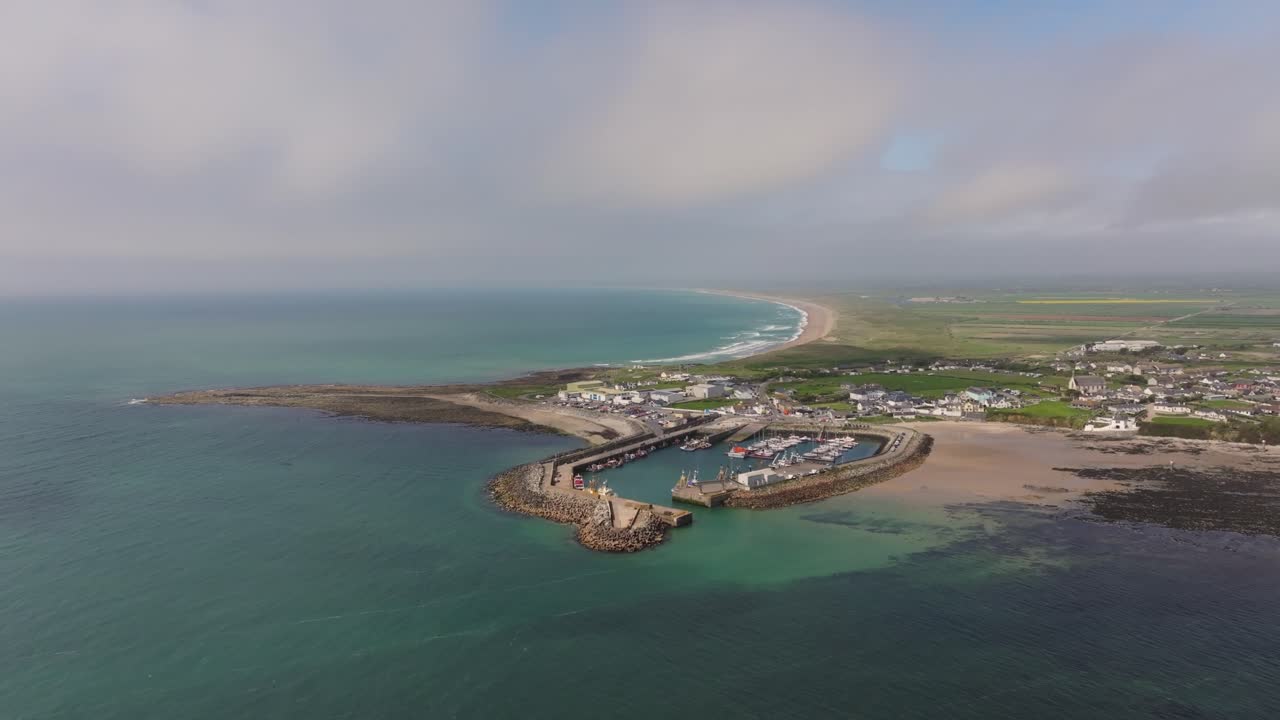 4K cinematic drone footage capturing Kilmore Quay, Co. Wexford, Ireland, on a bright day, showcasing the picturesque harbour, and colourful fishing boats Co.Wexford - Ireland_016