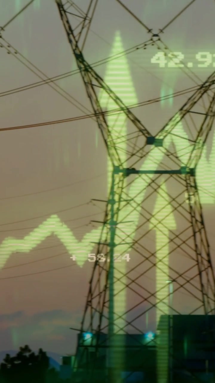 Vídeo vertical: Câmera panorâmica para a direita revelando torres, com um gráfico neon entrando pela esquerda rastreando dados de energia.