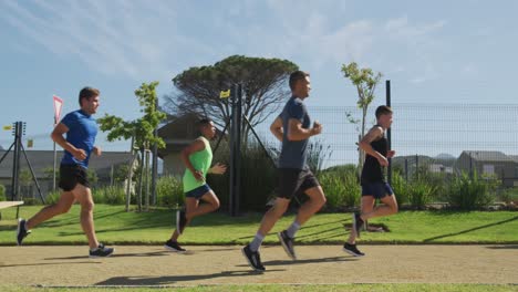 Men-running-outside-on-sunny-day