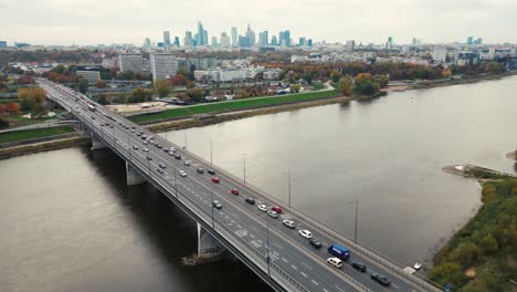 aerial drone top view of highway multilevel junction in urban populated area, city panorama background