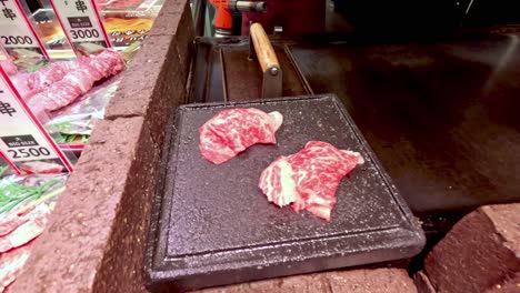 wagyu beef sushi being prepared and displayed