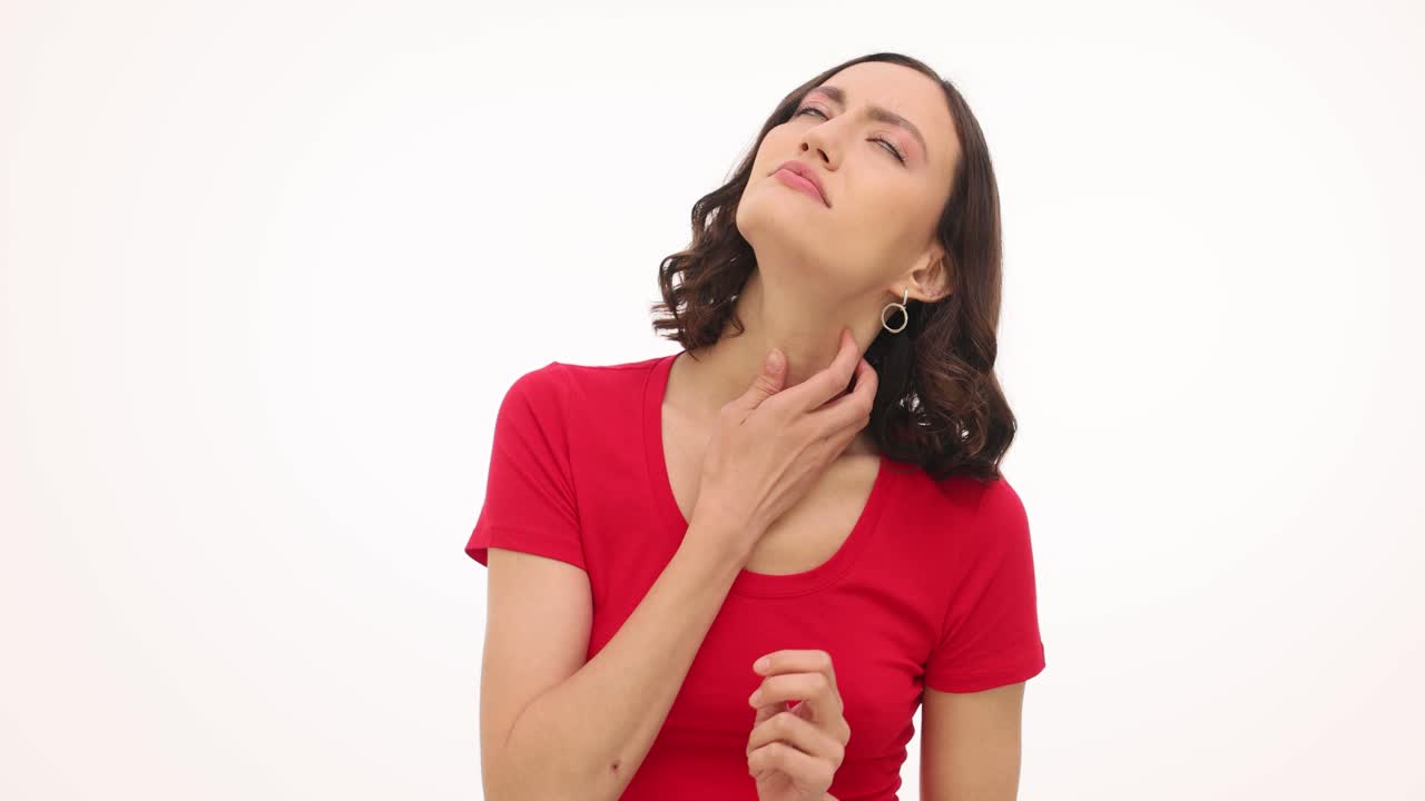 Woman suffering from sore throat or neck pain
