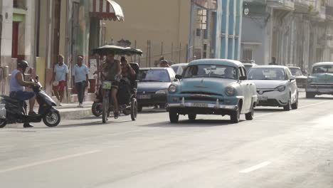 havana street scene with vintage cars and motorbikes