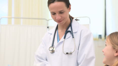 doctor holding xrays with a patient