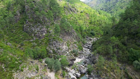 Aerial-Sightseeing-over-Fafião,-Montalegre,-and-Gerês-Rivers-and-Bridges-in-the-National-Park-of-Northern-Portugal-on-a-Sunny-Day